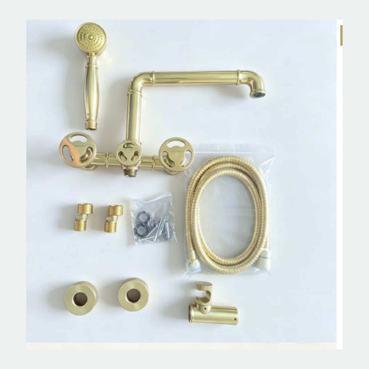Unlacquered Brass Wall-Mount Tub Filler with Articulated Pipe Spout, Handshower and Spoke Wheel Handles technical document