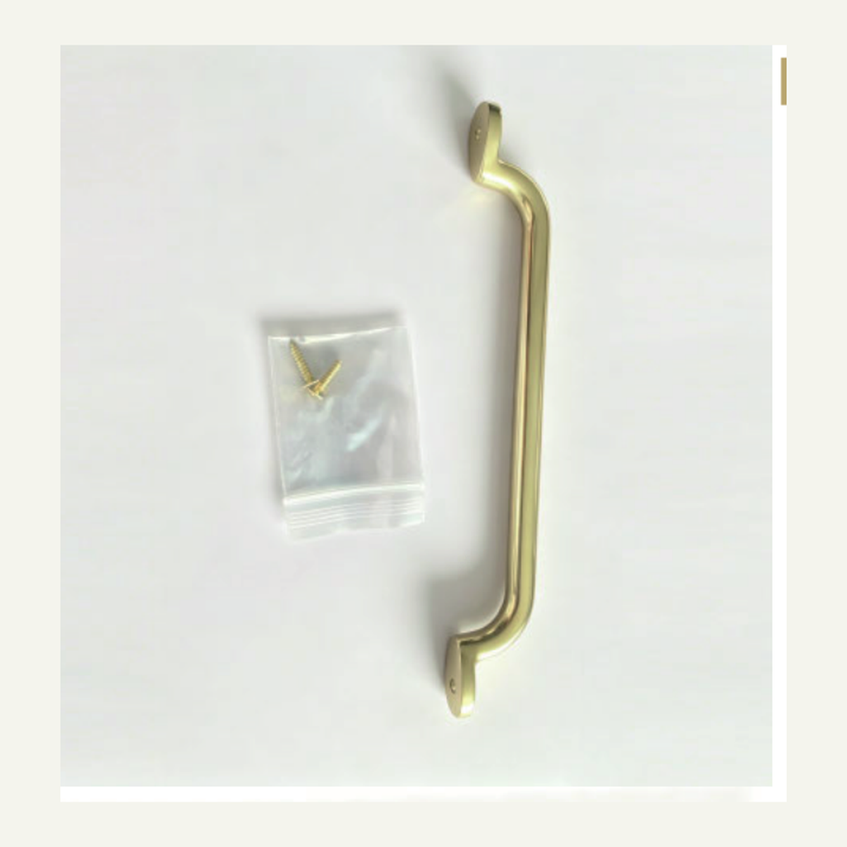 Solid Unlacquered Brass Cabinet Pull with Flat Strap Grip and Rolled Scroll Ends technical document